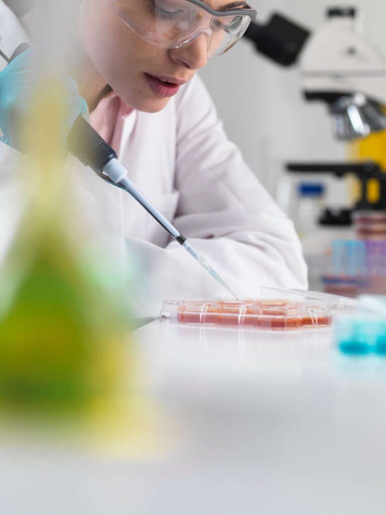 Scientist pipetting stem cells in tubes